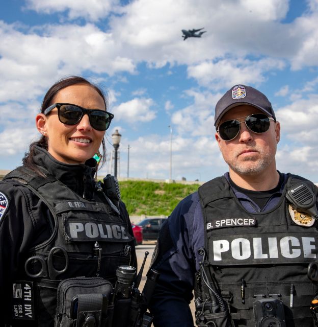 Two police officers standing outside.